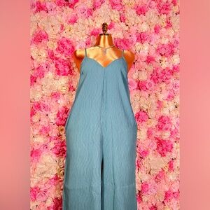 Sleeveless Pleated Wide Leg Jumpsuit w/ Pockets.
